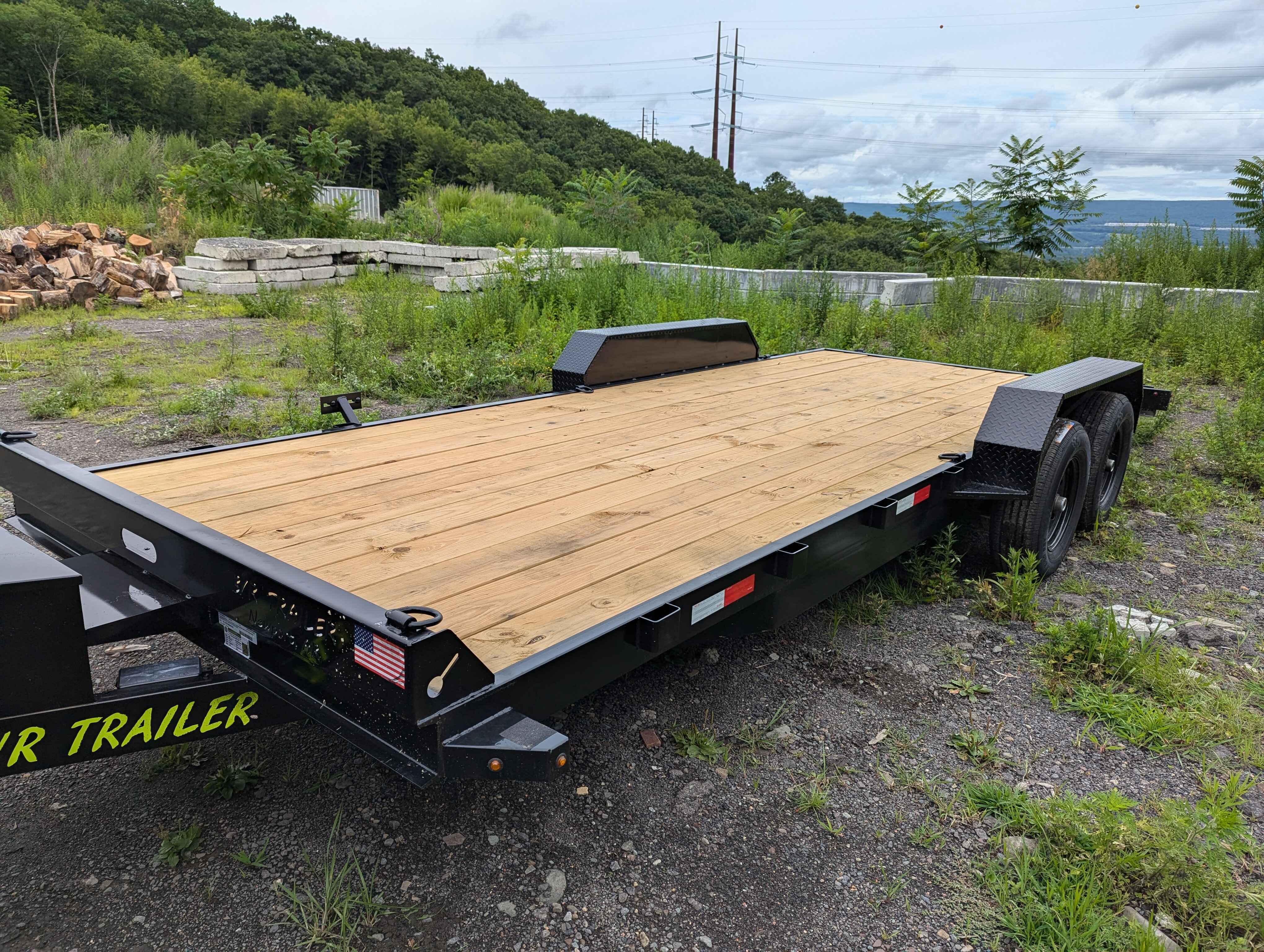 Car hauler trailer rental Scranton PA - specialized vehicle transport trailer with tie-down points and loading ramps for cars trucks ATVs